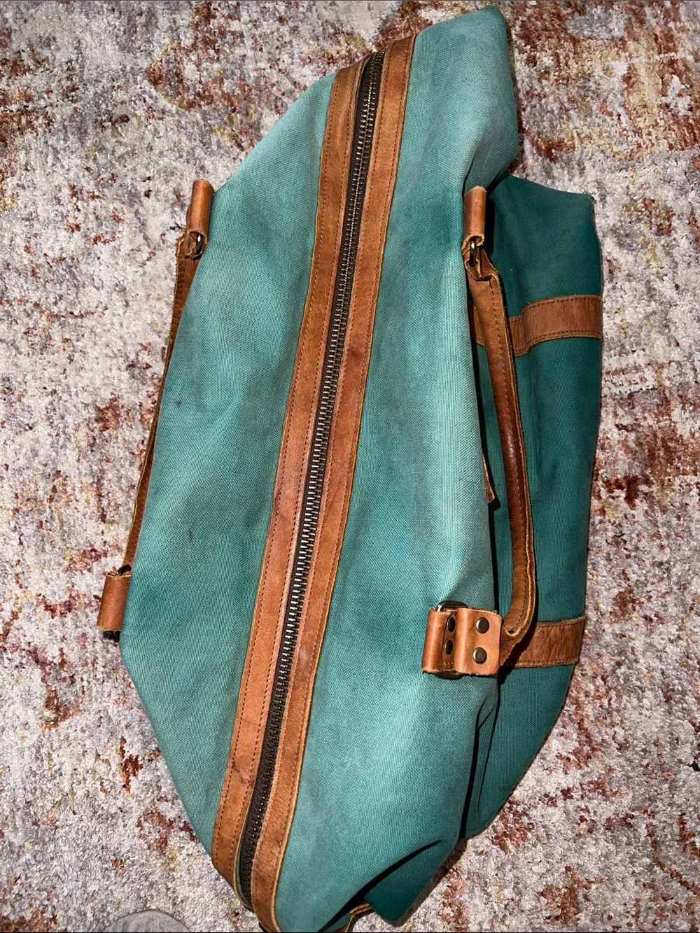 Vintage green duffle bag with leather handles